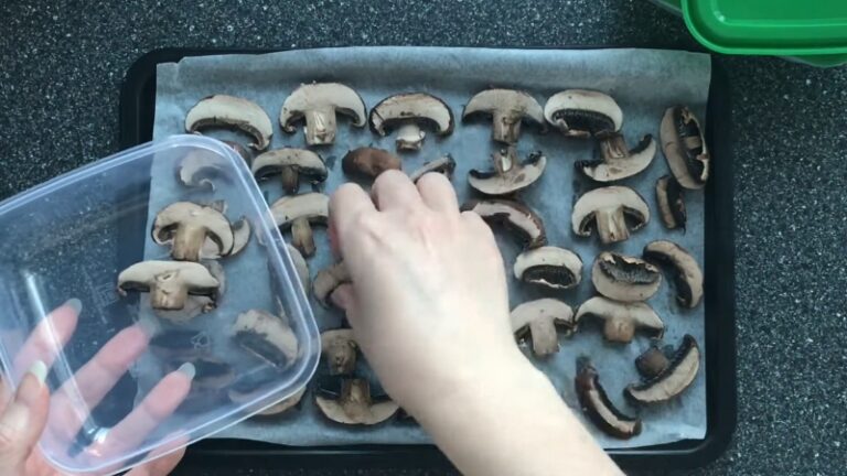 Sliced mushrooms are placed on a tray for prep to freeze mushrooms properly